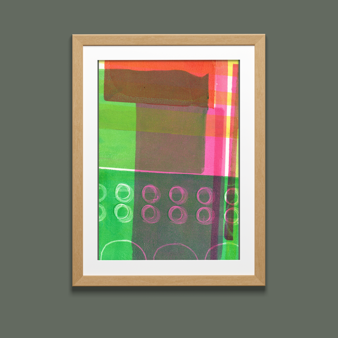 Framed abstract art with colorful geometric design on a gray background