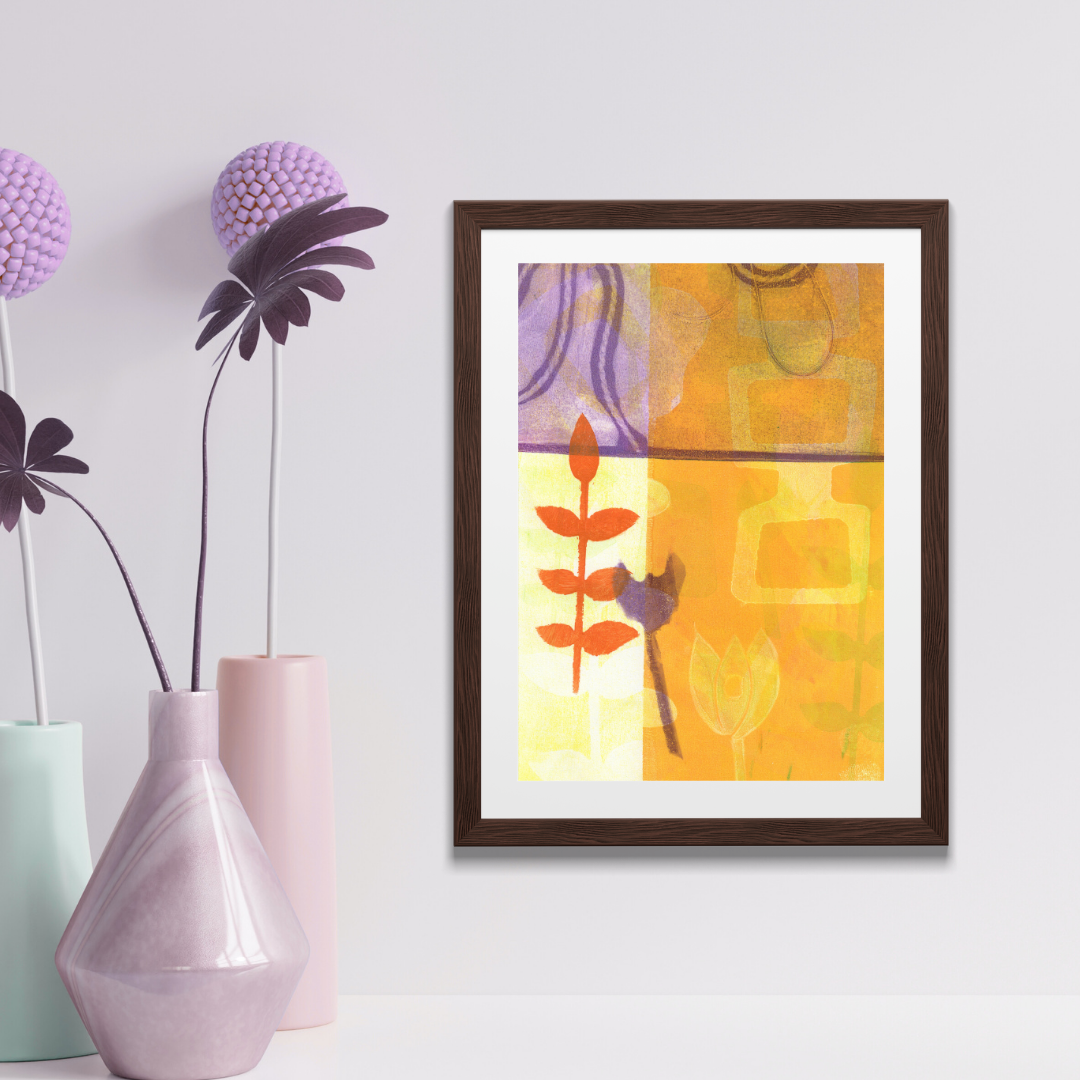 Framed abstract art piece on a wall with decorative vases and flowers.