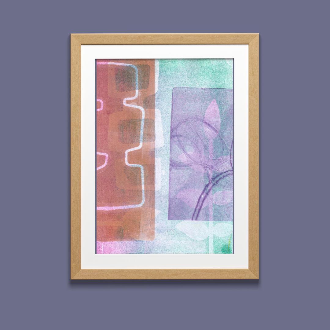 Framed abstract art print with pink and purple abstract design on a blue background