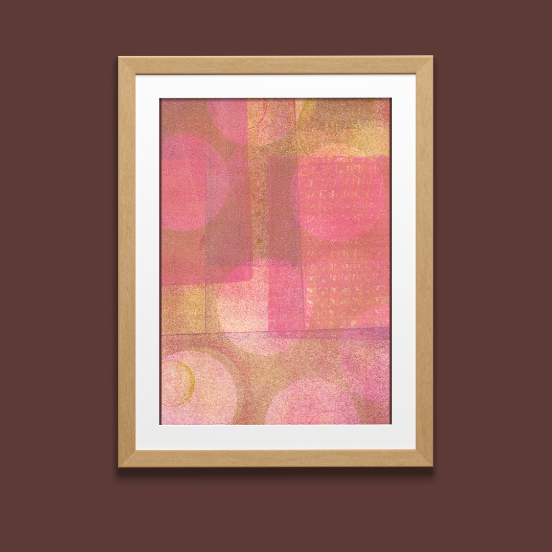 Framed abstract art print with pink and brown colors on a brown background
