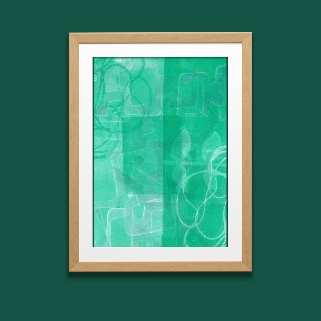 Framed abstract art print with green and white abstract design on a green background