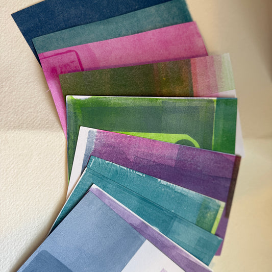 Set of colorful paper collage scraps arranged on a neutral background